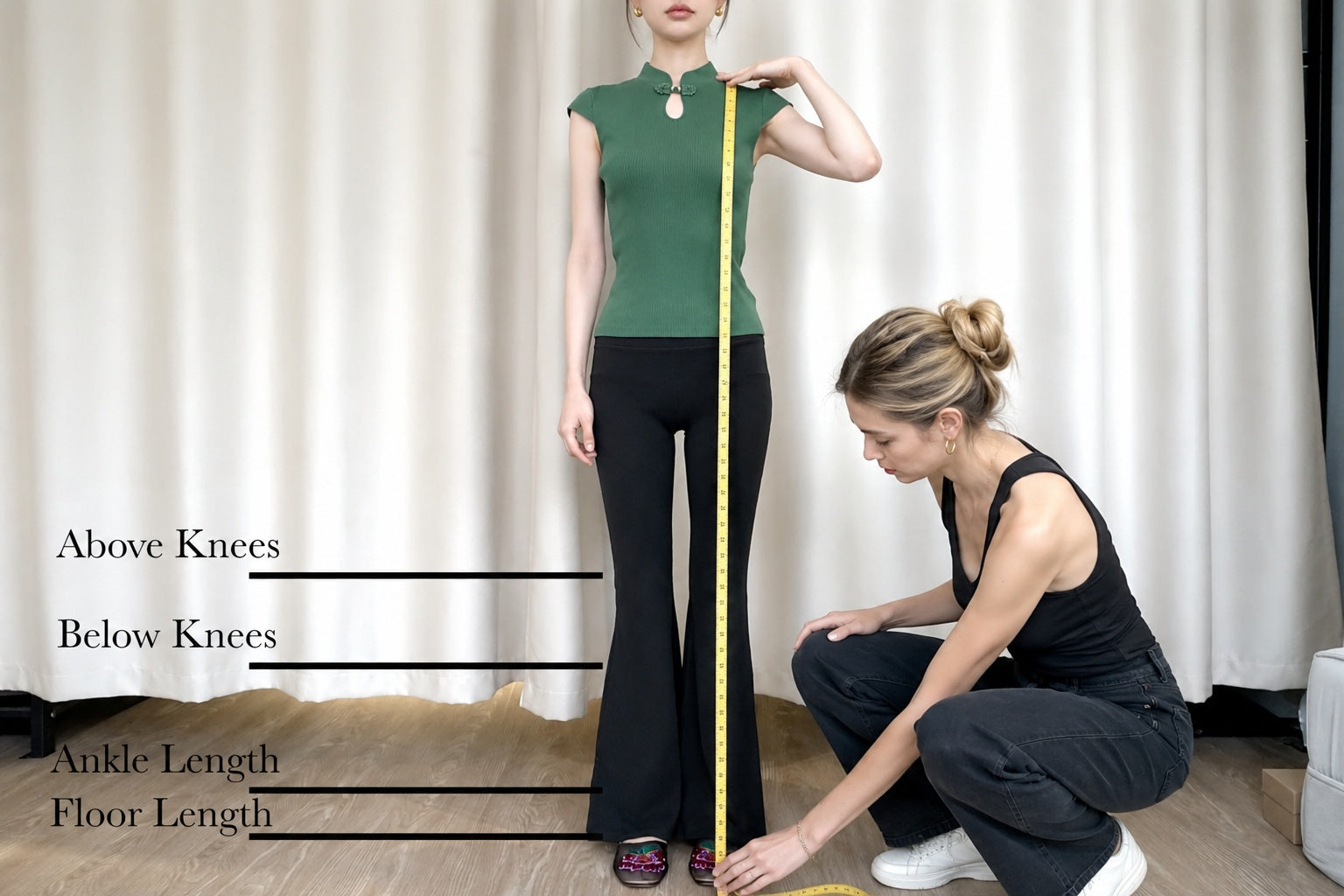 Measuring the desired dress length from shoulder to hem