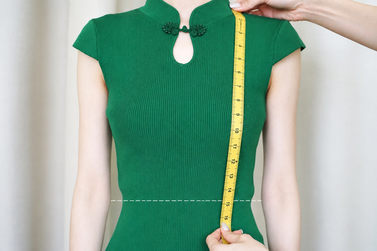 Measuring the front waist length from shoulder to waist